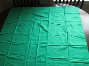 Green Material Laid Out On Table